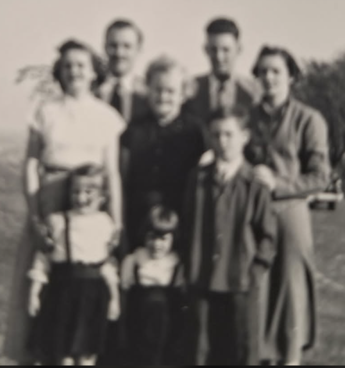 Original photo before FixPix restoration — A full family portrait — every face clear again.